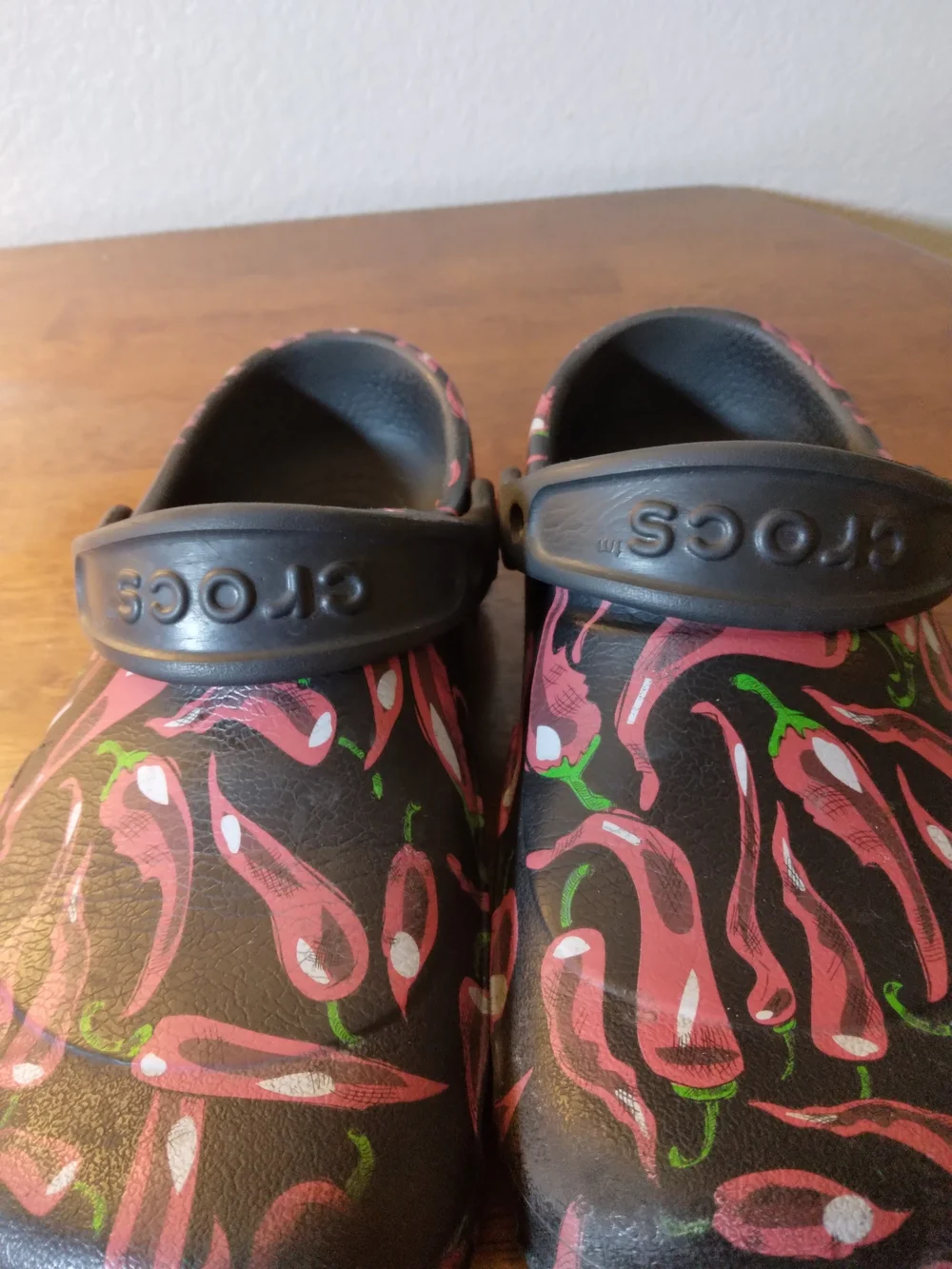 CROCS Kids Chili Pepoer Print Clogs in Black and Red